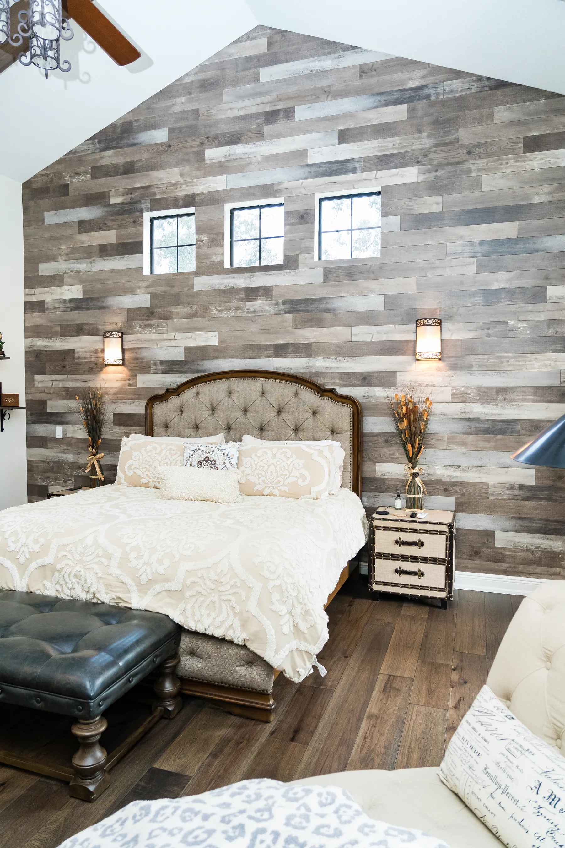 Hardwood bedroom floor with wood accent wall