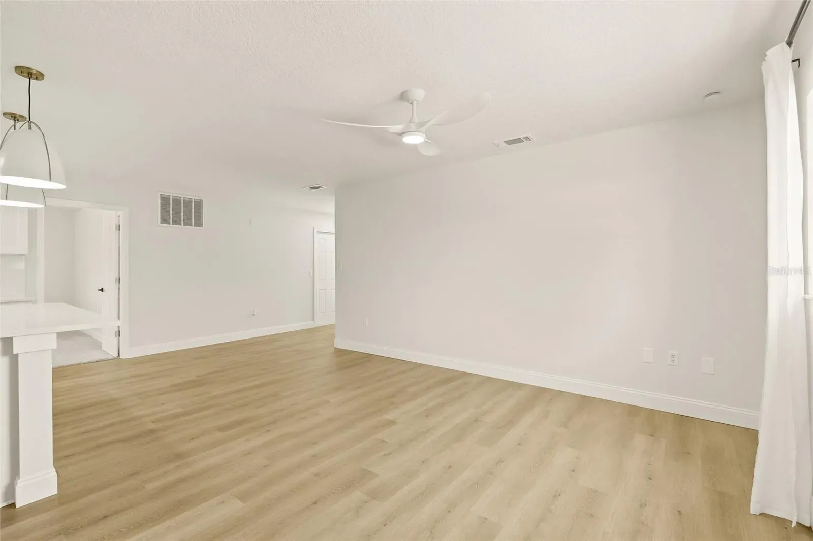 LVP living room open to kitchen Holiday FL