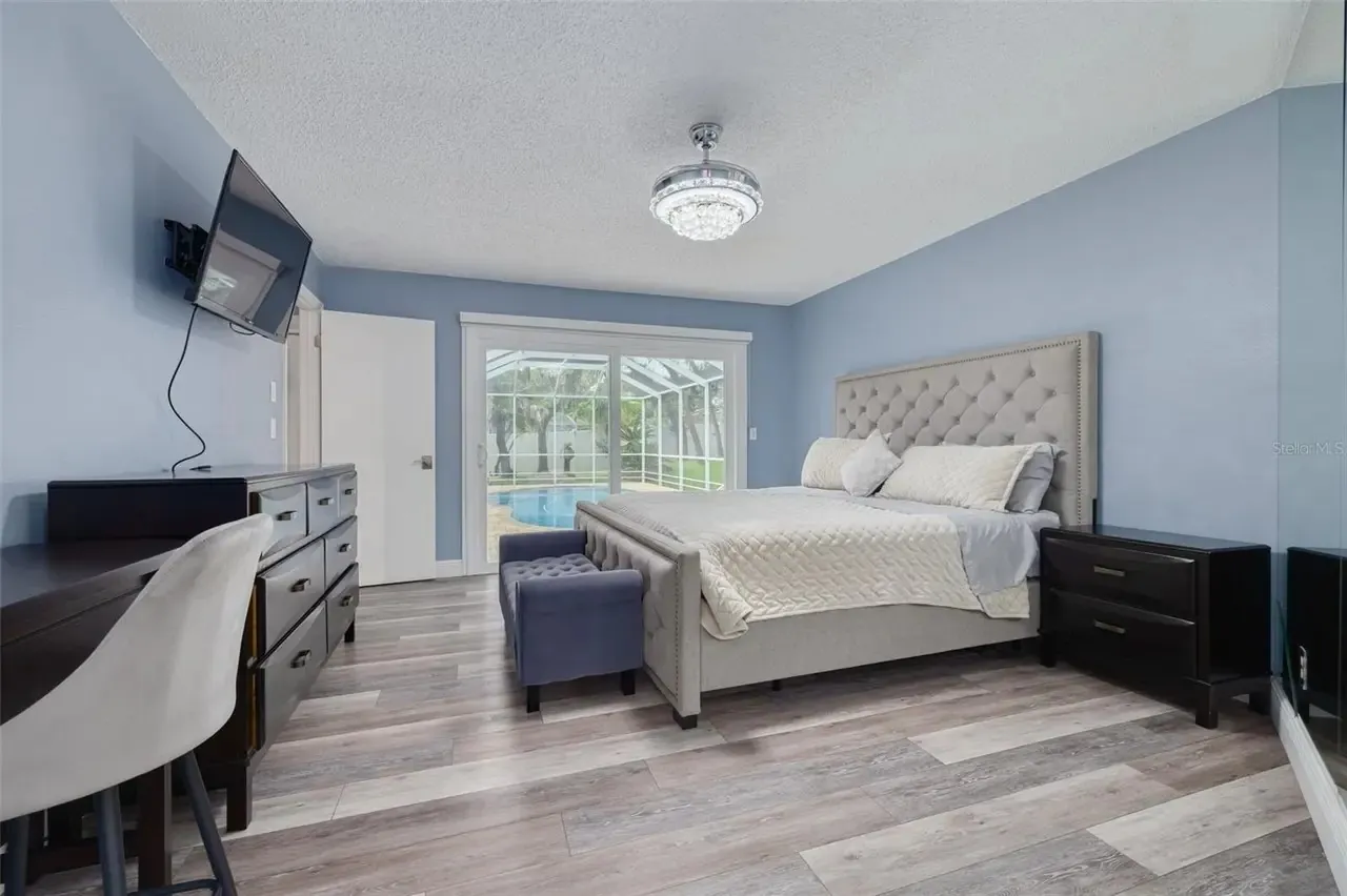 LVP master bedroom pool view Holiday FL