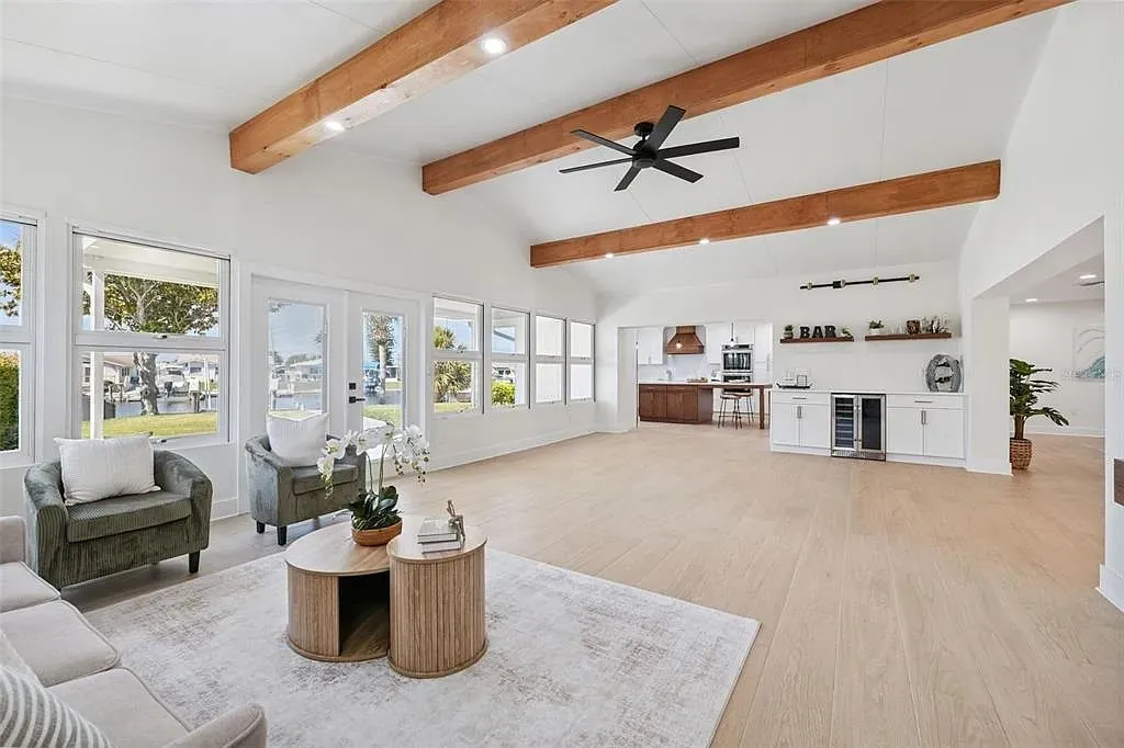 Tile living room waterfront vaulted beams Holiday FL